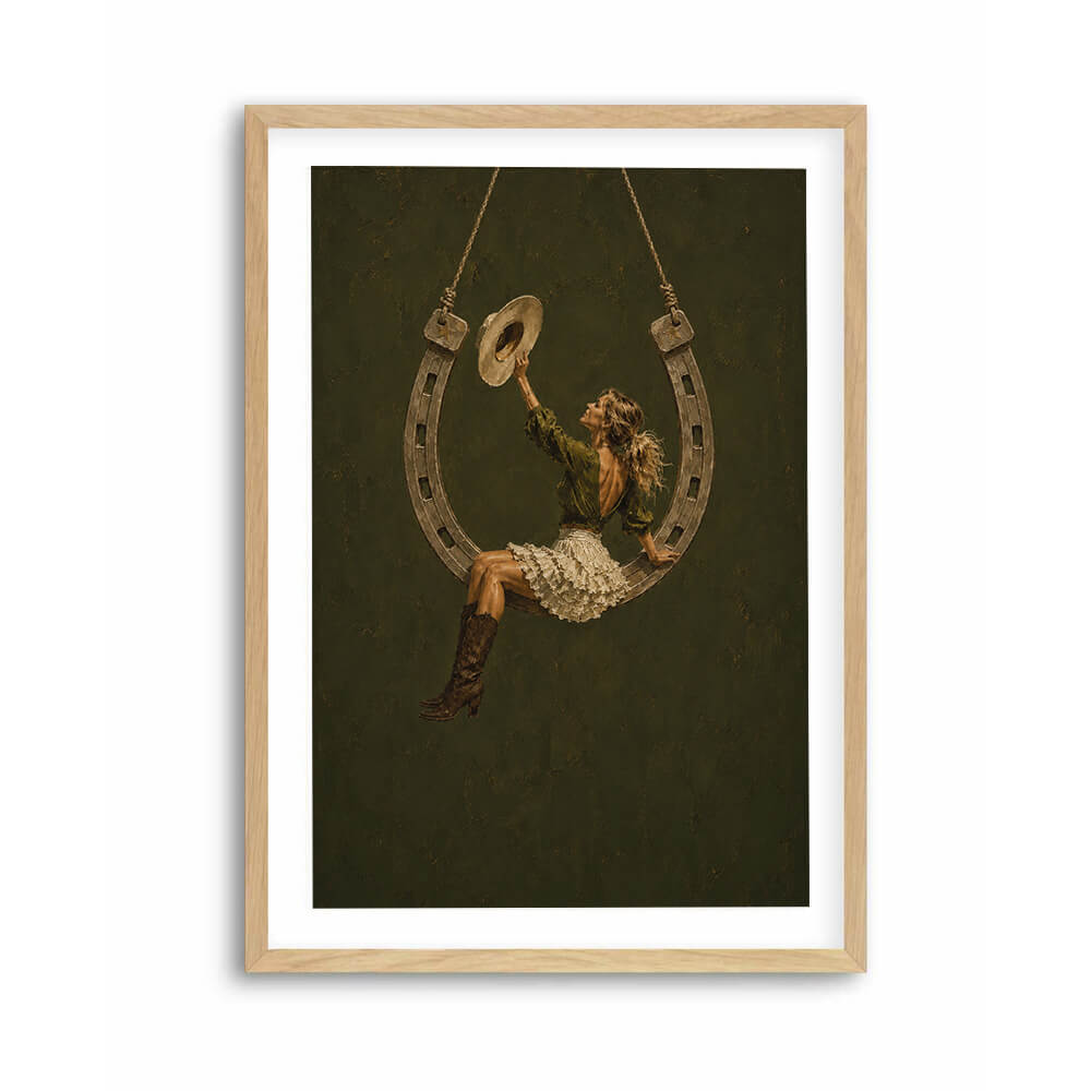 Southwestern wall art featuring cowgirl reaching for her cowboy hat
