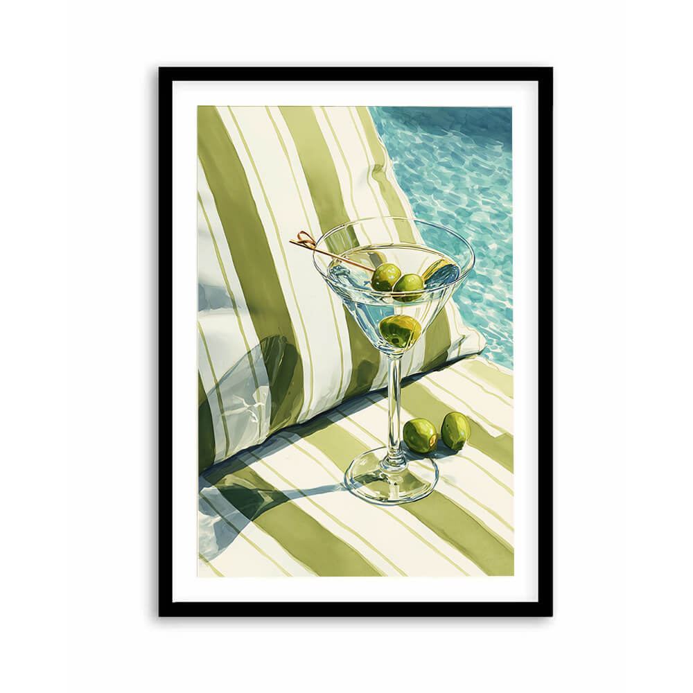 Coastal martini wall art featuring an olive cocktail beside a striped poolside lounge and turquoise water.