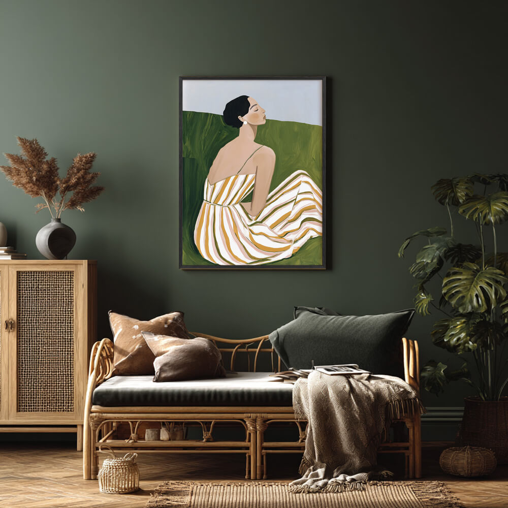 Minimalist wall art print of a seated woman in a striped summer dress, framed in black, ideal for modern living rooms or bedrooms.