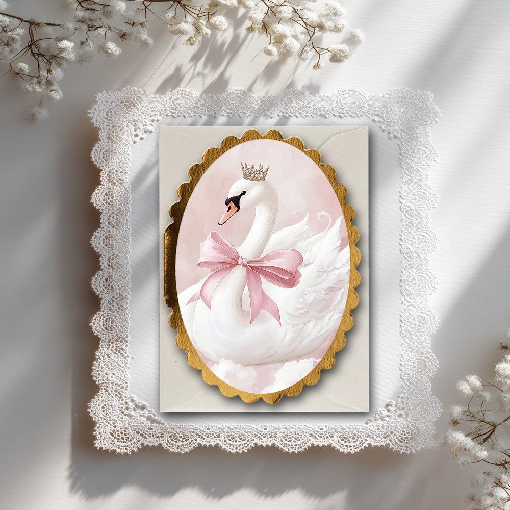 Decorative card with a swan design, pink bow, and gold scolloped card