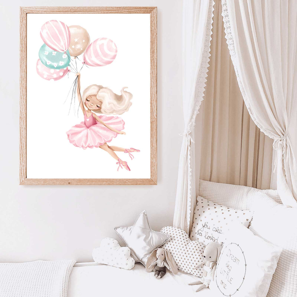Girls white bed with canopy and wall art with ballerina floating with pastel coloured balloons