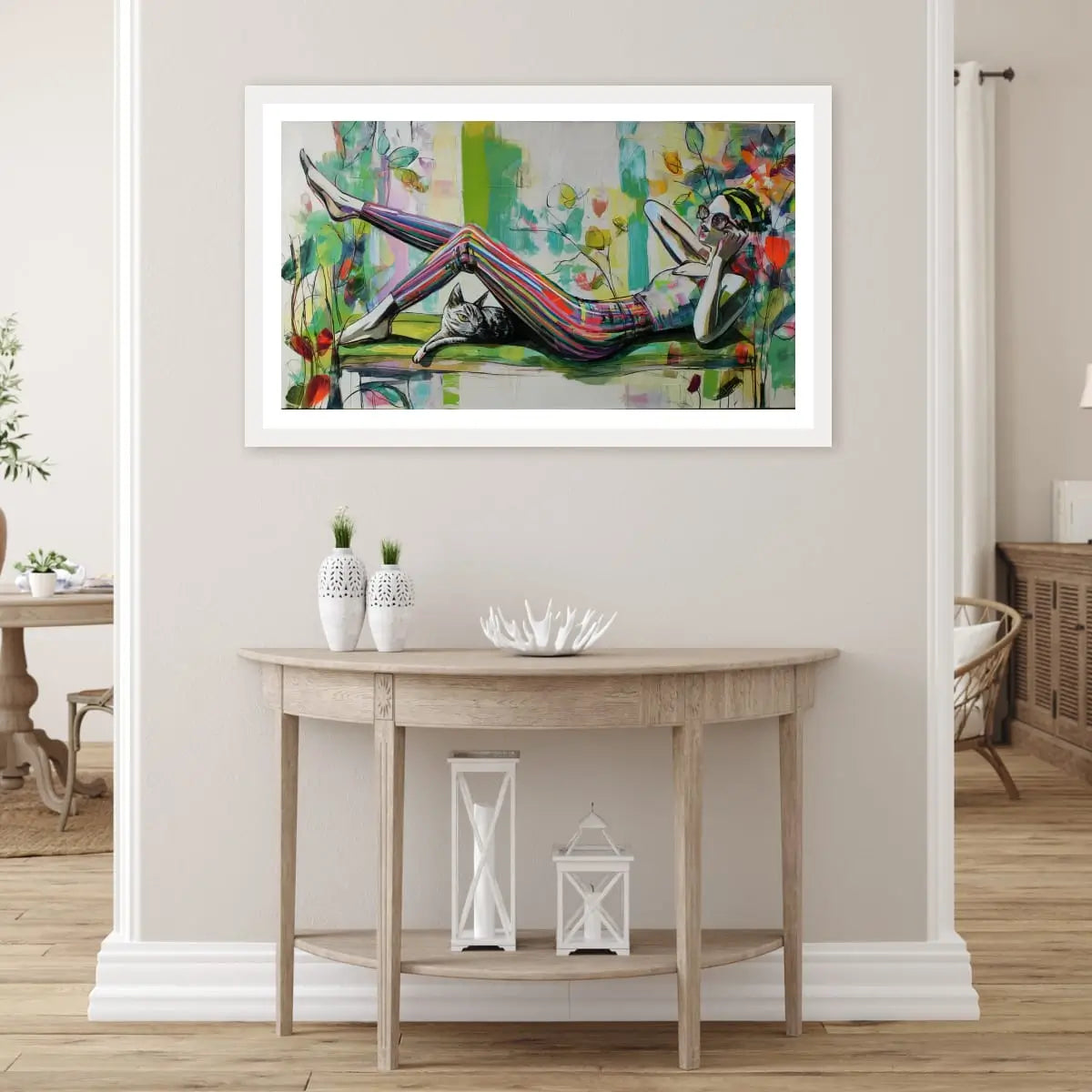 Abstract art print of woman lying on couch with striped pants and cat

