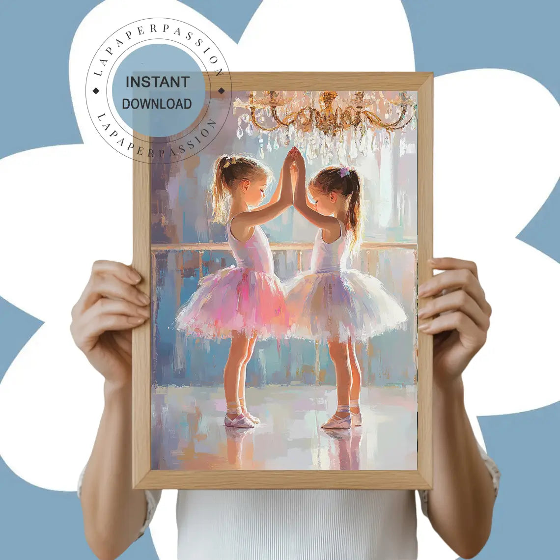 Two young ballerinas in pink and white tutus touching hands in a dance studio under a chandelier