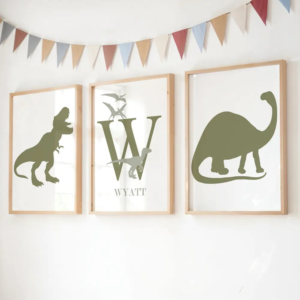 Three framed dinosaur prints with a central &#39;W&#39; and the name &#39;Wyatt&#39;, above a decorative flag banner. Customise with any name or colours