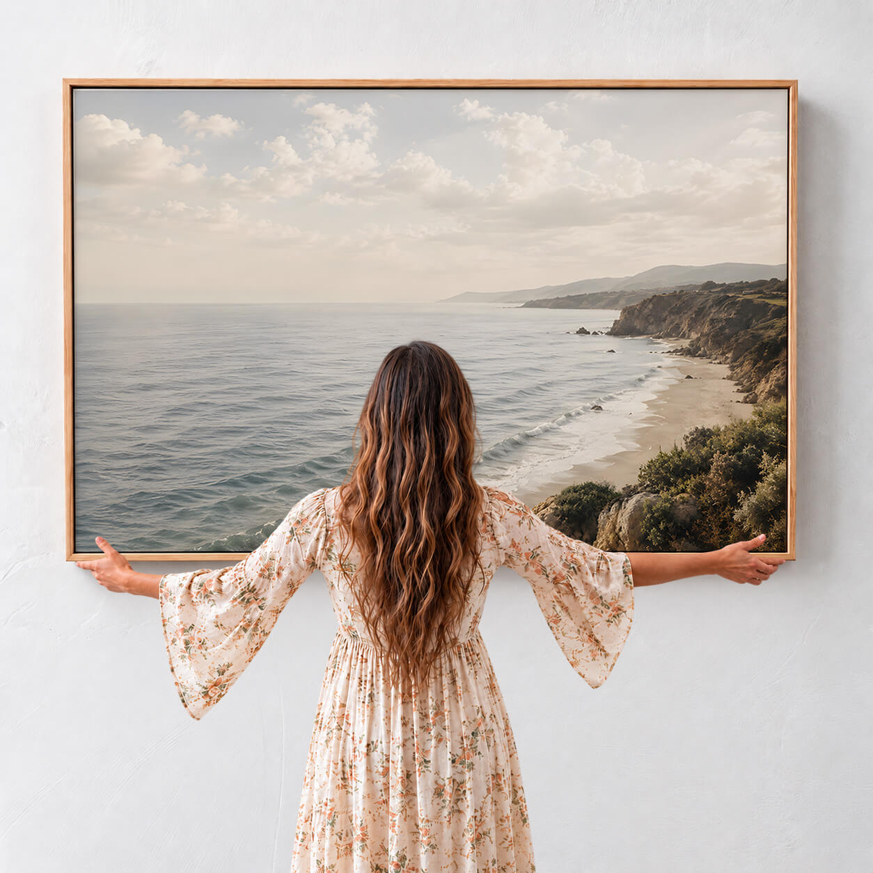 Coastal cliffs wall art featuring a peaceful ocean shoreline with rolling waves, golden cliffs and a soft sunlit sky, available as a premium framed canvas . Modern organic wall art.