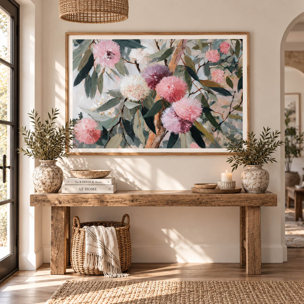 Pink eucalyptus botanical wall art in a natural timber frame displayed in a warm neutral living room