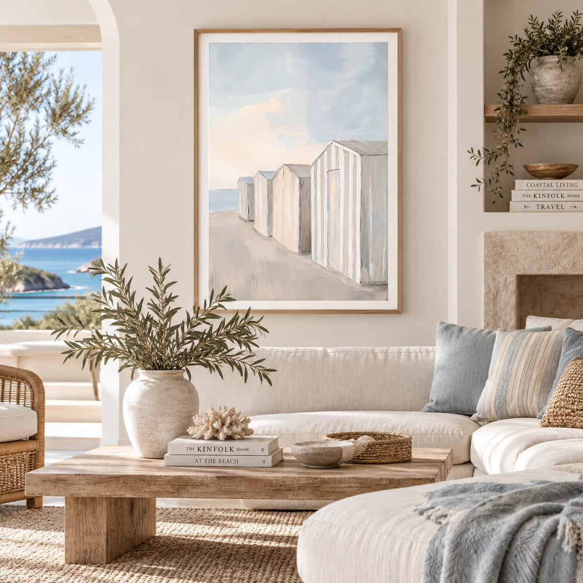Coastal beach hut art in a natural timber frame above a rustic timber console