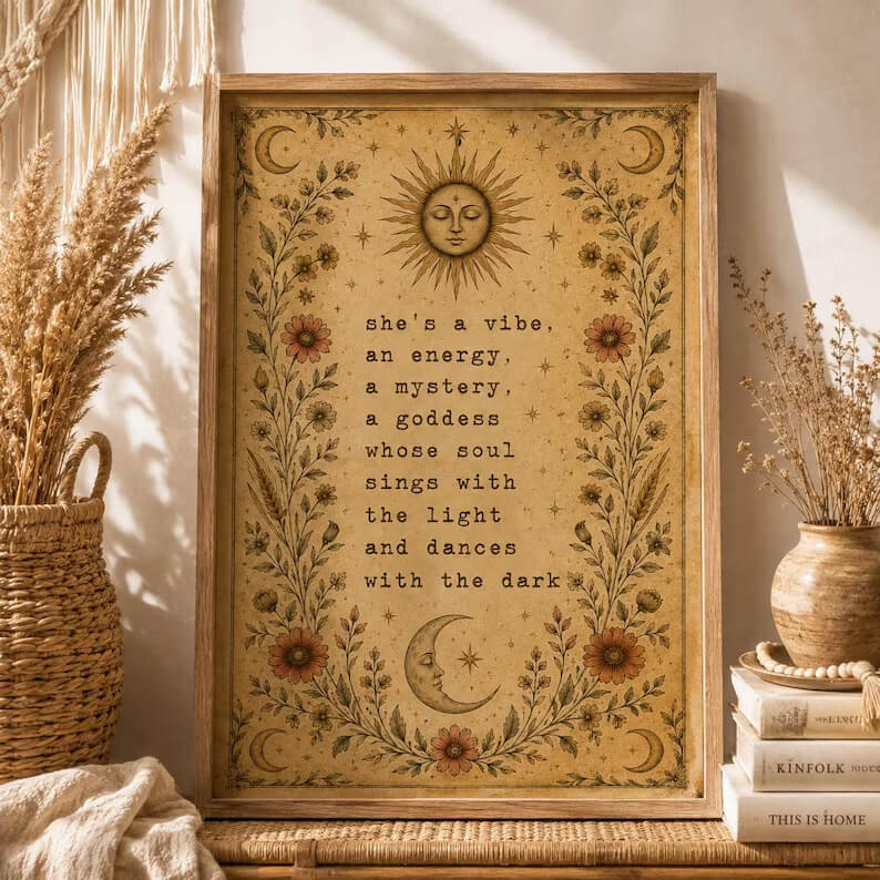 Celestial g wall art print featuring a vintage sun, crescent moon, stars and botanical flowers in warm earthy tones.