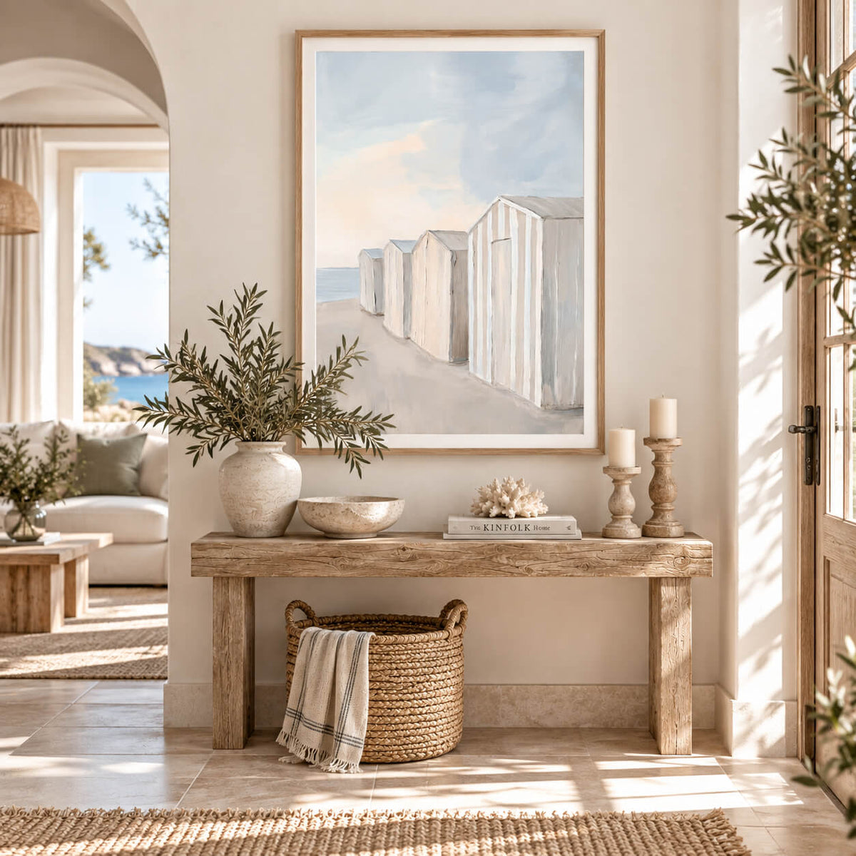 Coastal wall art featuring softly painted beach huts in cream, neutral and pale blue tones