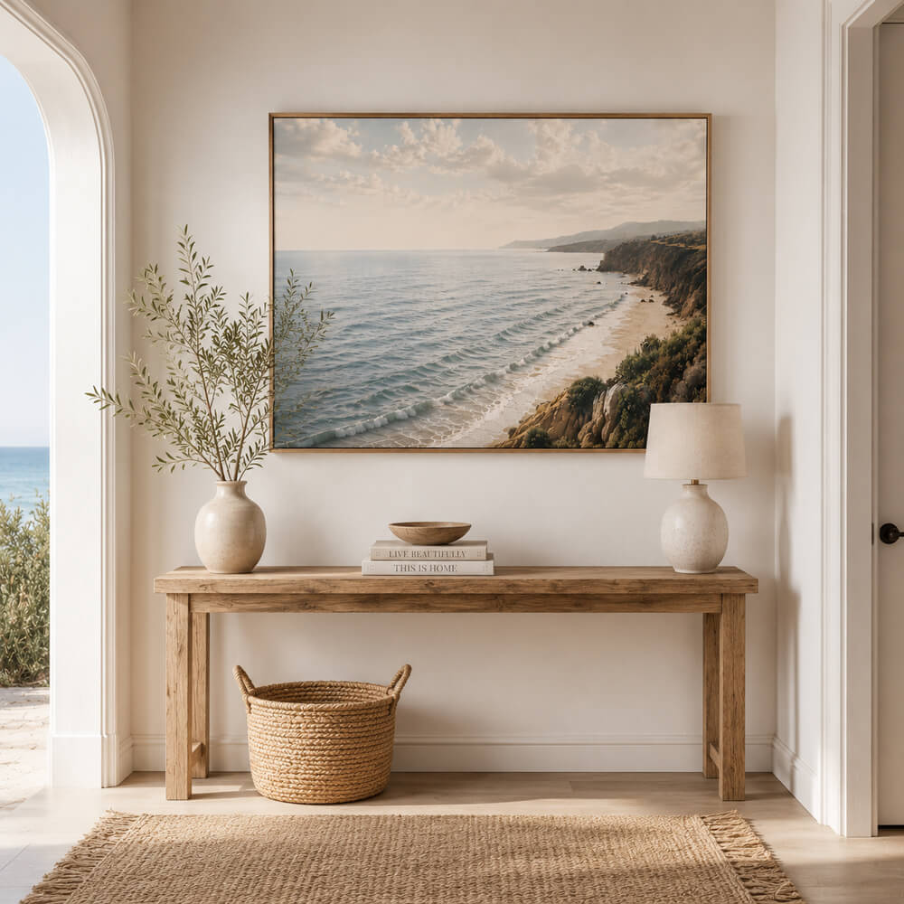 Coastal cliffs wall art featuring a peaceful ocean shoreline with rolling waves, golden cliffs and a soft sunlit sky, available as a premium framed canvas 