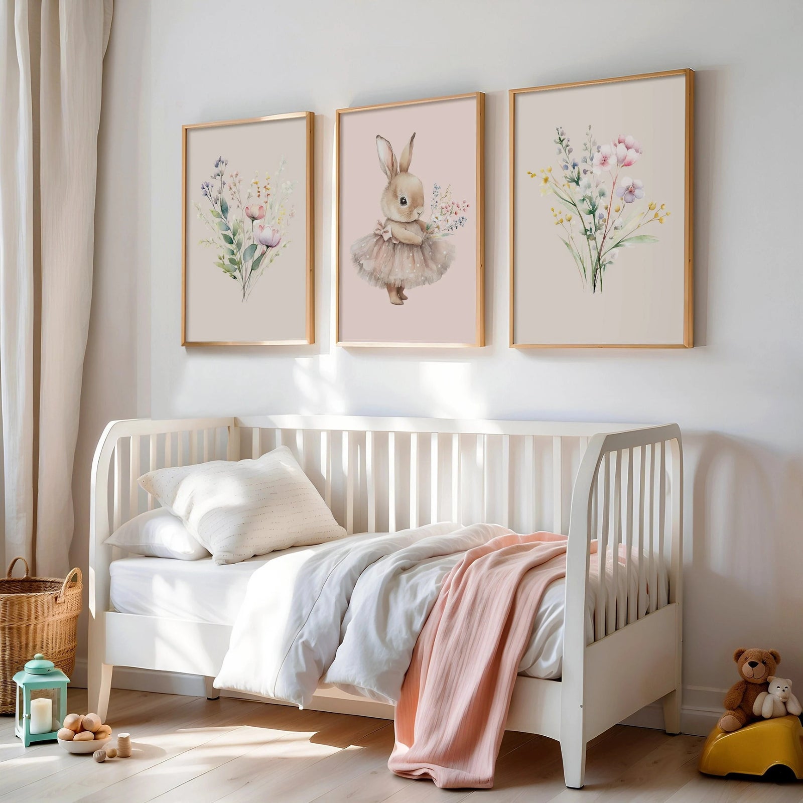 Set of 3 printed Nursery wall art prints that come in standard International sizes. Side prints  are Beige and a centre pastel pink print. Illustrations are   wildflowers and  a bunny in a tutu holding a posy of wildflowers. Printed on 250 gsm paper.