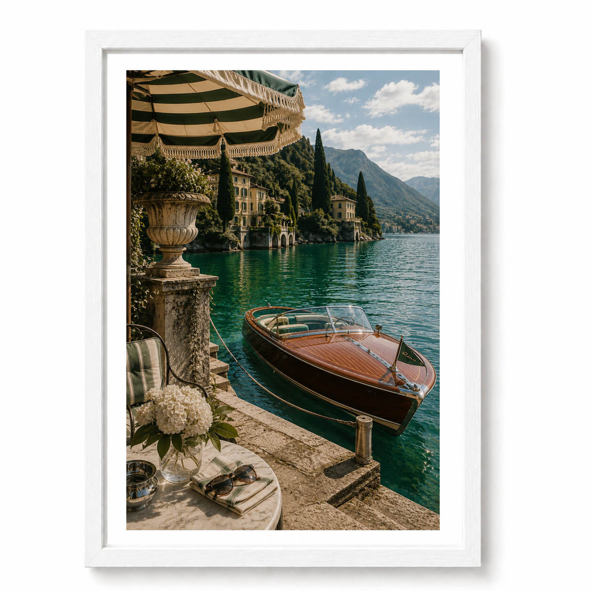  striped parasol, ornate stone terrace and classic wooden boat nostalgic European summer feel, capturing the glamour of leisurely days spent beside the Italian lakes.