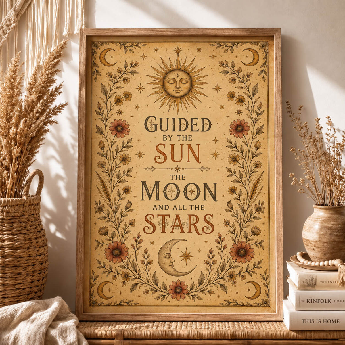 Celestial sun and moon wall art print featuring stars, botanical vines and vintage floral details in warm earthy tones.
