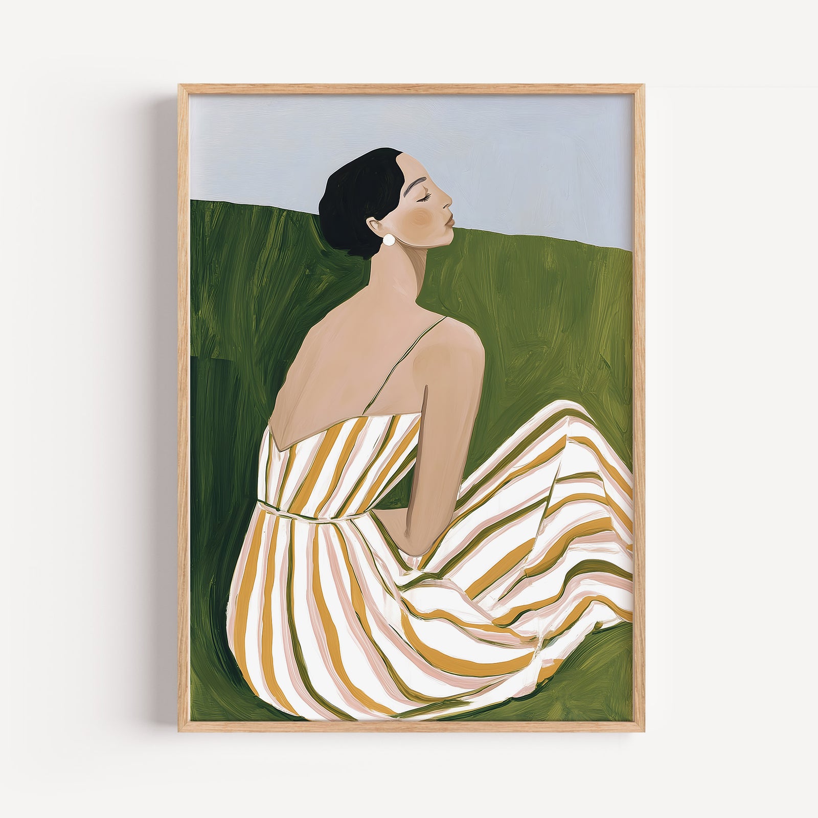 Minimalist wall art print of a seated woman in a striped summer dress, framed in natural oak