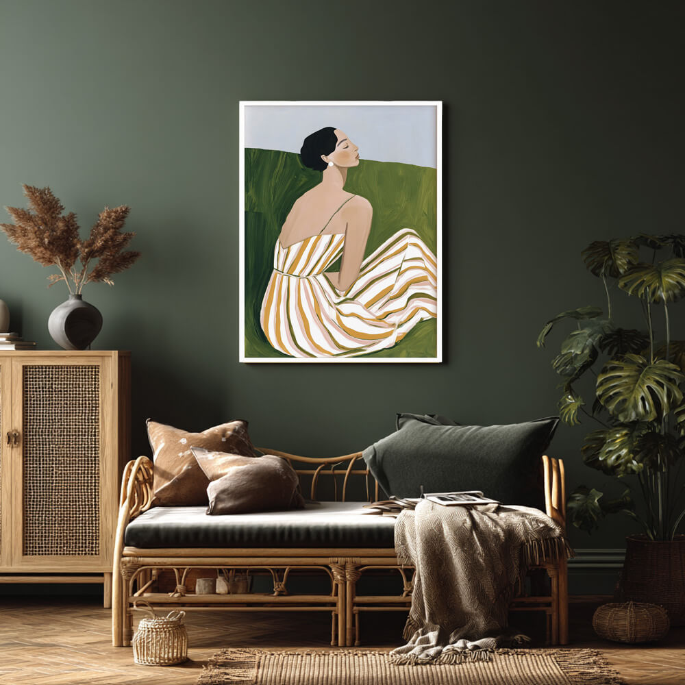 Alt text: Minimalist wall art print of a seated woman in a striped summer dress, framed in white, perfect for contemporary interiors.